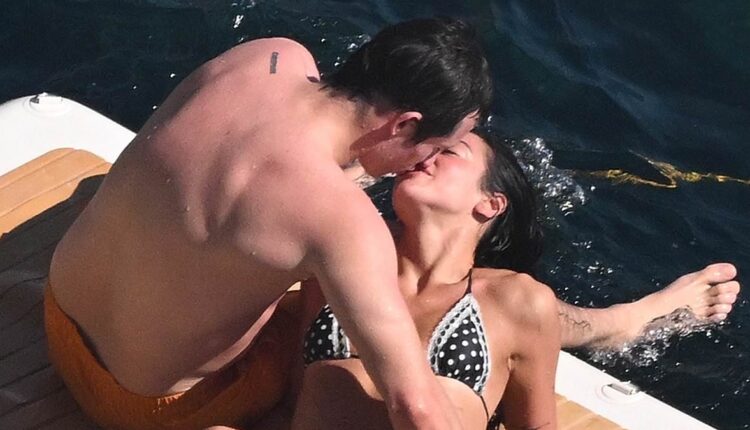 Dua Lipa and fiancé Callum Turner can't keep their hands off each other as they share a passionate kiss during romantic Amalfi Coast getaway